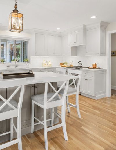 falmouth kitchen with taupe colored island and white cabinets